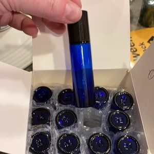 12 brand new cobalt 10 ml roller ball vials. Complete set with all caps, rollers